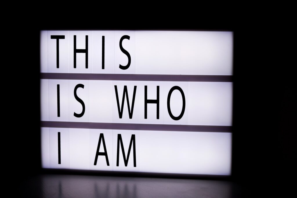 Backlit sign that says This Is Who I Am