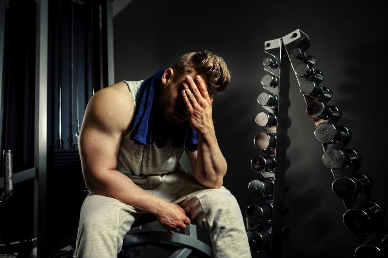 man looking stressed after workout